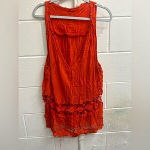 Woman’s small orange cotton sleeveless tunic top